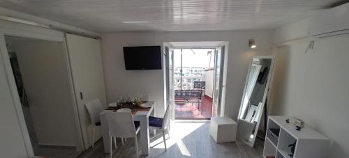 a living room with a table and a dining room at MIRAMAR Apartman in Novi Vinodolski