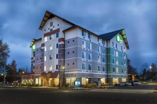 a large building on the side of a street at Holiday Inn Express & Suites - Seattle South - Tukwila by IHG in Tukwila