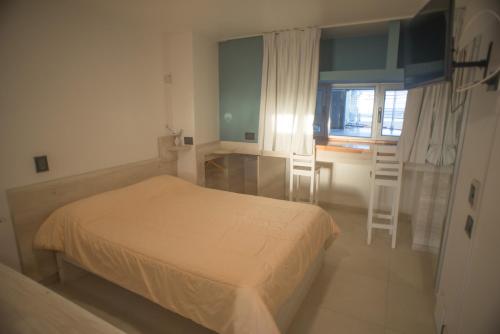 En eller flere senge i et værelse på Amares Apart - Departamentos 4 y 5