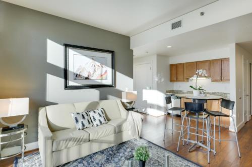 a living room and kitchen with a couch and a table at Renu Suites at The Burlington Portland in Portland