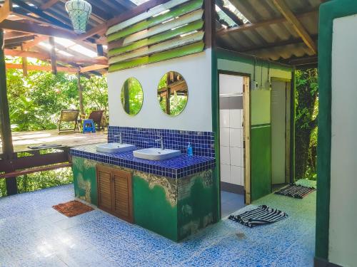 a bathroom with two sinks in a house at forestel homestay kohkood ฟอเรสเทล โฮมสเตย์ เกาะกูด in Ban Khlong Chao