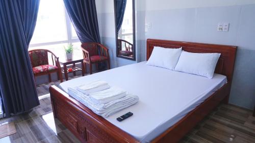 Кровать или кровати в номере Homestay Bảo Trân