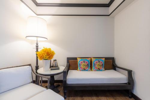 Un ou plusieurs lits dans un hébergement de l'établissement MORA Boutique Hotel