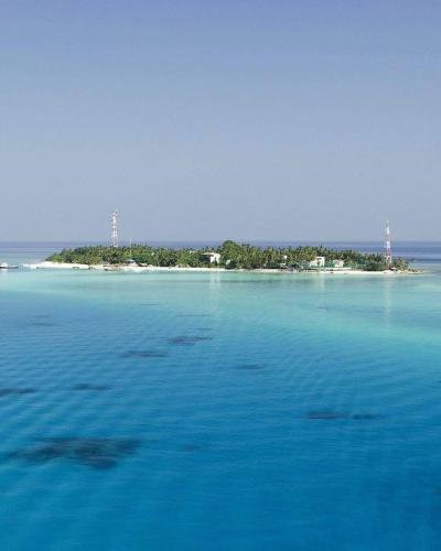 an island in the middle of a large body of water at Seena Inn in Fulidhoo