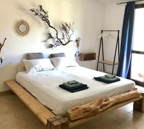 Ein Bett oder Betten in einem Zimmer der Unterkunft I Ginepri