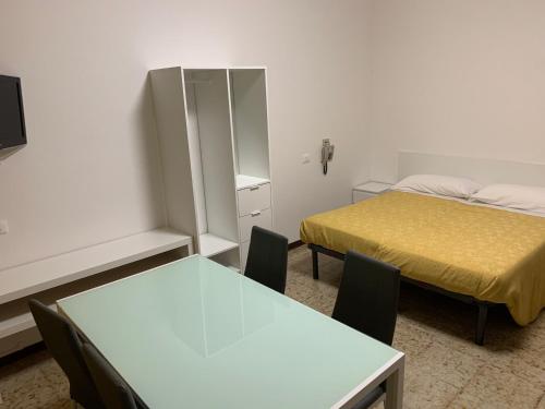 Кровать или кровати в номере Hotel San Pellegrino