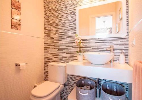 a bathroom with a toilet and a sink at Spectacular views of the sea, Punta Lara, Nerja, Nº7 in Nerja