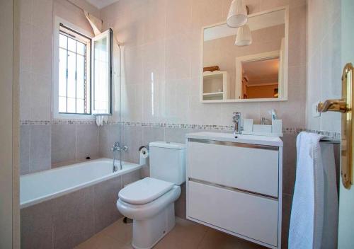 a bathroom with a toilet and a tub and a sink at Spectacular views of the sea, Punta Lara, Nerja, Nº7 in Nerja