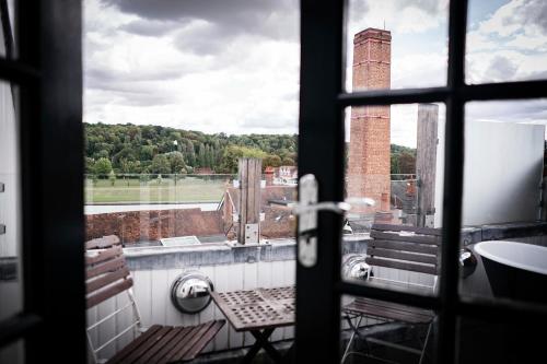 a view from a window of a bathroom with a view at Hotel du Vin Henley in Henley on Thames