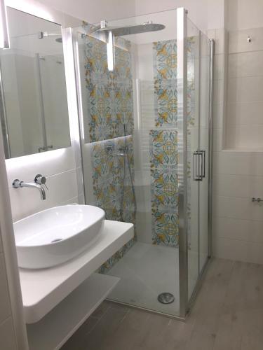 a bathroom with a sink and a shower at Ugento Dimora in Ugento