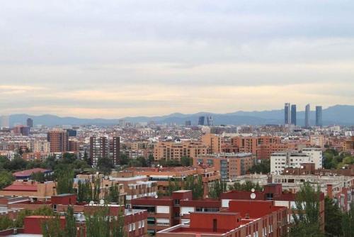 a view of a city with tall buildings at Porcel Torre Garden in Madrid