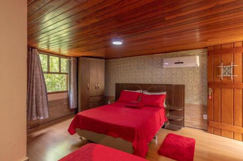 Una cama o camas en una habitación de Pousada Cascata dos Amores