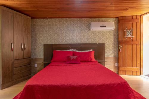 Una cama o camas en una habitación de Pousada Cascata dos Amores