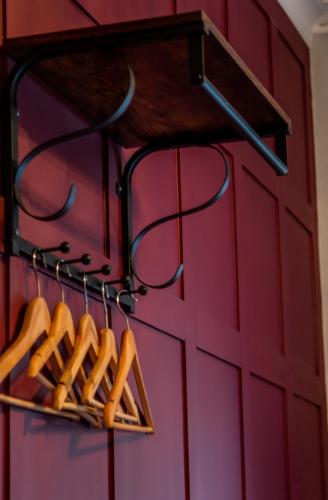 a bunch of hot dogs on a rack next to a door at Abbey Court Guest House in Carlisle