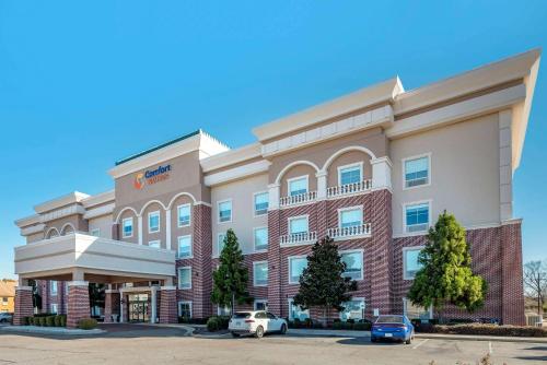 a rendering of a hotel with cars parked in front at Comfort Suites West Memphis I-40 I-55 in West Memphis