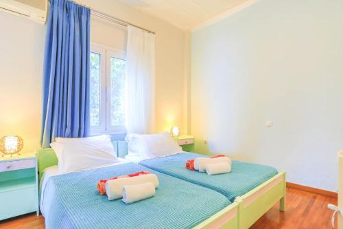 A bed or beds in a room at Villa Natasha