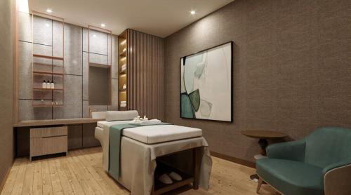 a bathroom with a sink and a table and a chair at Holiday Inn Chandigarh Zirakpur by IHG in Chandīgarh