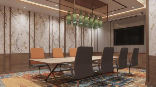 a conference room with a table and chairs at Holiday Inn Chandigarh Zirakpur by IHG in Chandīgarh