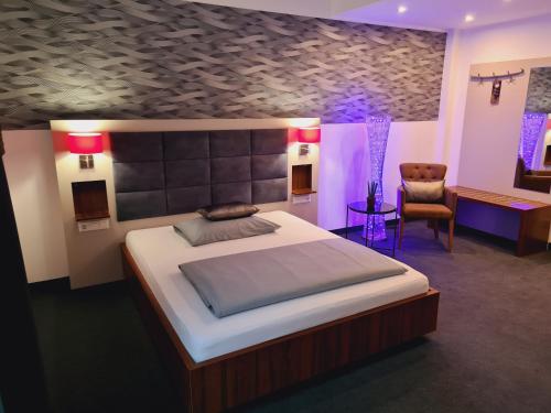 מיטה או מיטות בחדר ב-Hotel Starton am Village