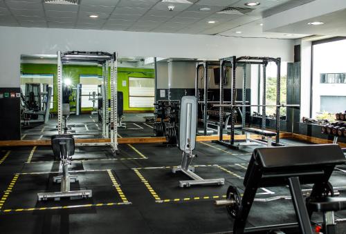 a gym with several treadmills and exercise machines at Athlone Springs Hotel in Athlone