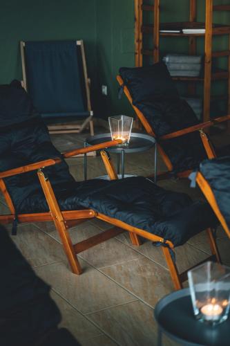 a room with three chairs and a table with candles at Hotel Sportalm - Adults Only Boutique Hotel in Bad Kleinkirchheim