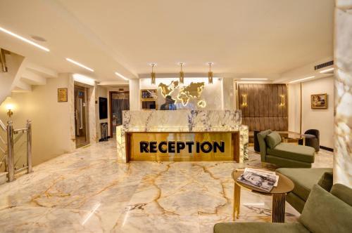 a living room with a reception sign on the wall at Hotel Ephesus Istanbul in Istanbul