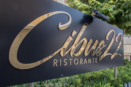 a sign for a hotelres restaurant at Hotel Giulia in Marina di Massa