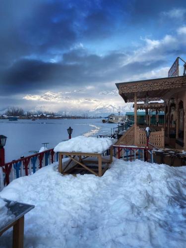 a snow covered deck with a gazebo with snow on it at Chicago Group of Houseboats in Srinagar
