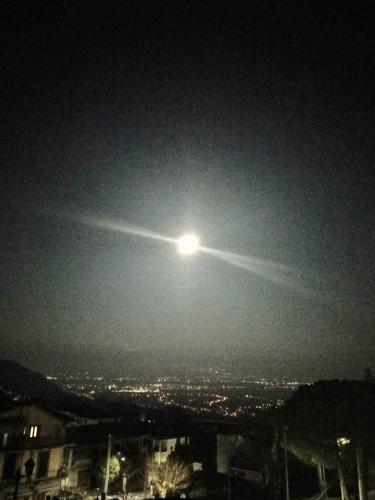 a light in the sky over a city at night at affittacamere rezzo in Monte San Giacomo