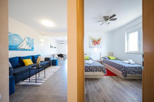 two views of a living room and a bedroom at 1oak rentals 2 in Vir