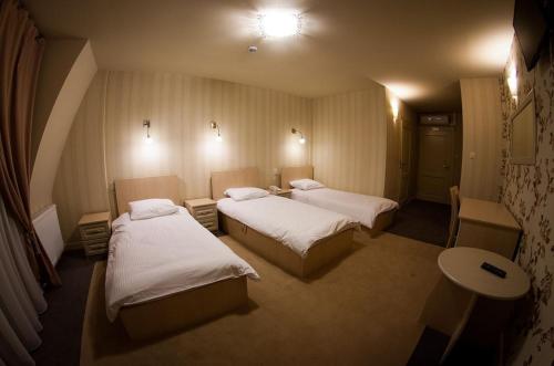 Postel nebo postele na pokoji v ubytování Hotel Regent