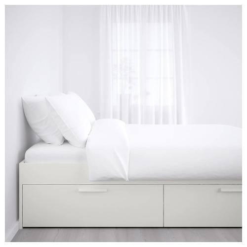 a white bed with white pillows and a window at City Apartment Fully Furnished - Lillestrøm-Strømmen in Lillestrøm