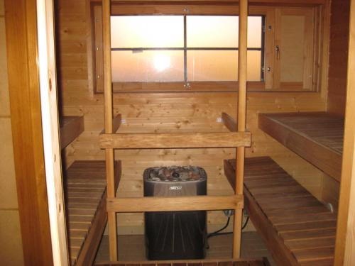 a inside of a sauna with a trash can at Hotelli Patruuna in Imatra