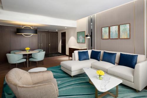 a living room with a couch and a table at Grand Hyatt Al Khobar Hotel and Residences in Al Khobar