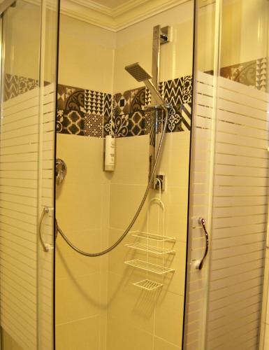 a shower with a glass door in a bathroom at Navona Residenza de Charme in Rome