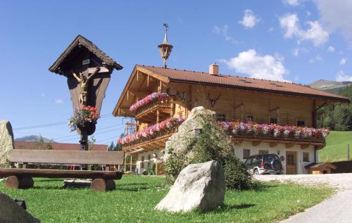 a building with a bench in front of it at Hotel Gasthof Abelhof in Neukirchen am Großvenediger