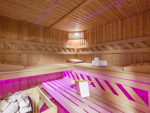 a inside of a sauna with pink lighting at Chalet Weinberg Top 1 & Top 2 by Apartment Managers in Kirchberg in Tirol