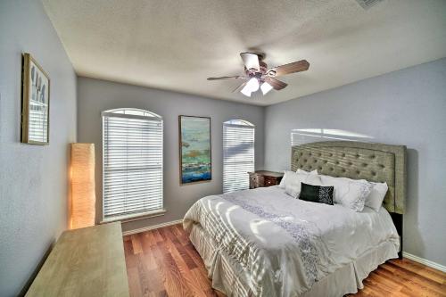 a bedroom with a bed and a ceiling fan at Peaceful San Antonio Oasis with Private Pool and Grill in San Antonio