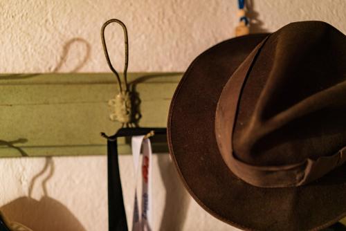a cowboy hat hanging on a wall next to at Etno House Shancheva in Kratovo
