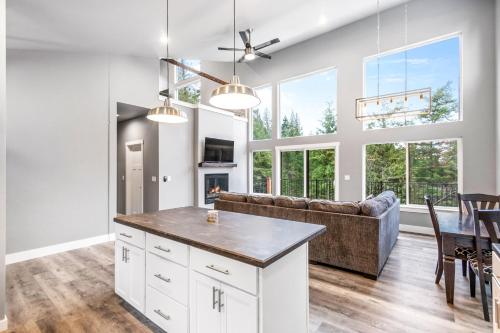 a kitchen and living room with a couch and a table at Eagles Nest in Sagle