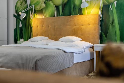 two beds with white pillows sitting next to each other at Palác Daun - Studio Apartments in Znojmo