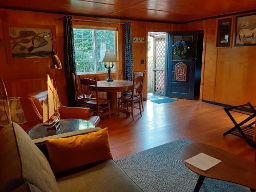 a living room with a couch and a table at Anchor Inn Resort in Lincoln City