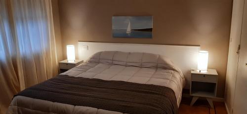 Łóżko lub łóżka w pokoju w obiekcie Casa Garay 602