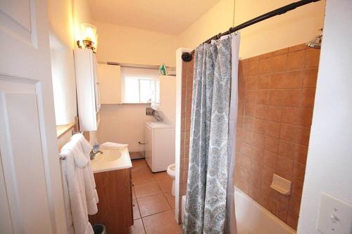 a bathroom with a shower and a toilet and a sink at Closson Casita - Patio & Fire Pit - Near Plaza - 1BR in Santa Fe
