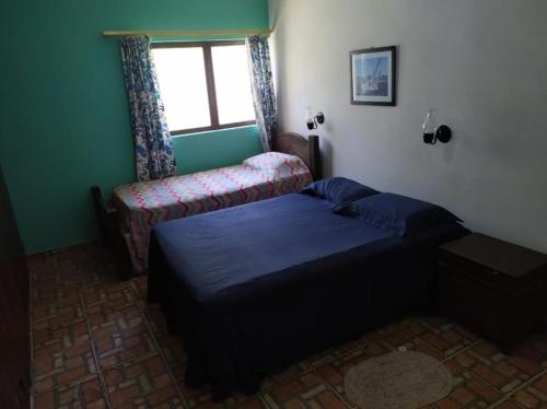 Ένα ή περισσότερα κρεβάτια σε δωμάτιο στο Guest House Vento e Mar