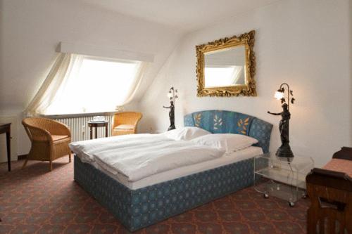 Cama o camas de una habitación en Hotel Behrmann
