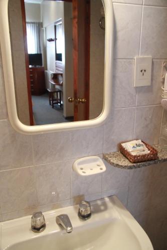 a bathroom with a sink and a mirror at Kalton in San Rafael