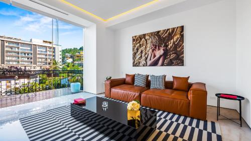 a living room with a couch and a large window at PIER 57 - 711 Fabulous & Dreamy 1 BR Romantic Zone in Puerto Vallarta