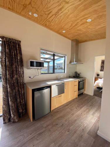 a kitchen with a sink and a counter top at Country Retreats on Ranzau 3 in Nelson