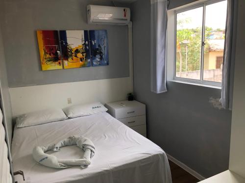 Postel nebo postele na pokoji v ubytování APARTAMENTO em NATAL